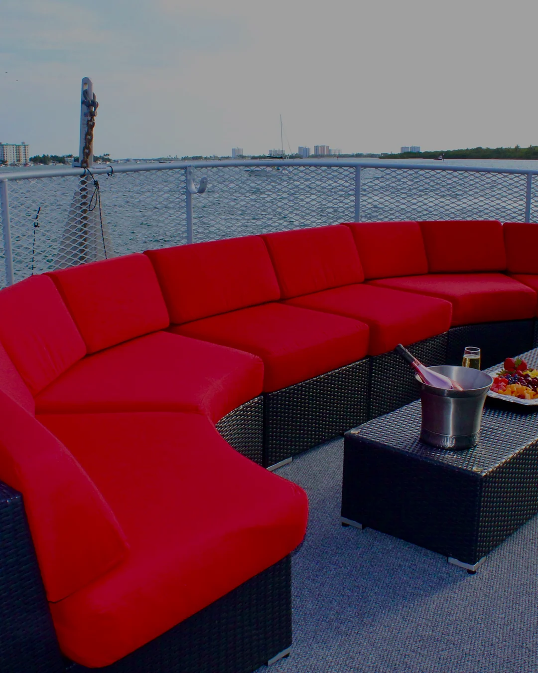 Upper deck red lounge aboard Opus Yacht Miami