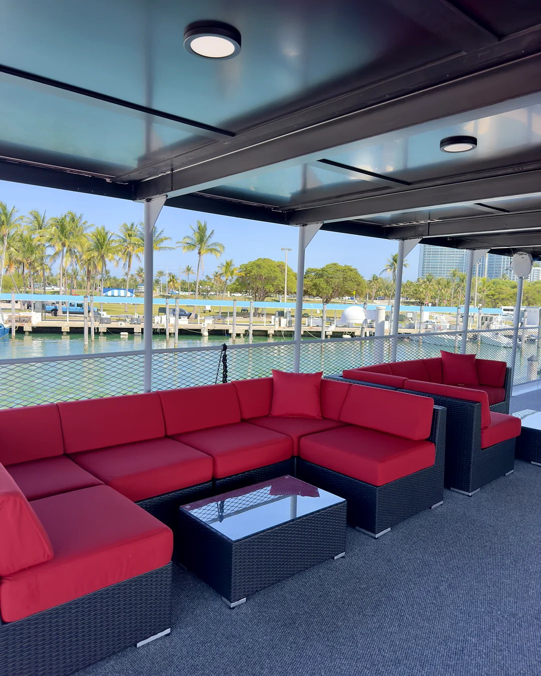 Shaded red lounge aboard Opus Yacht Miami