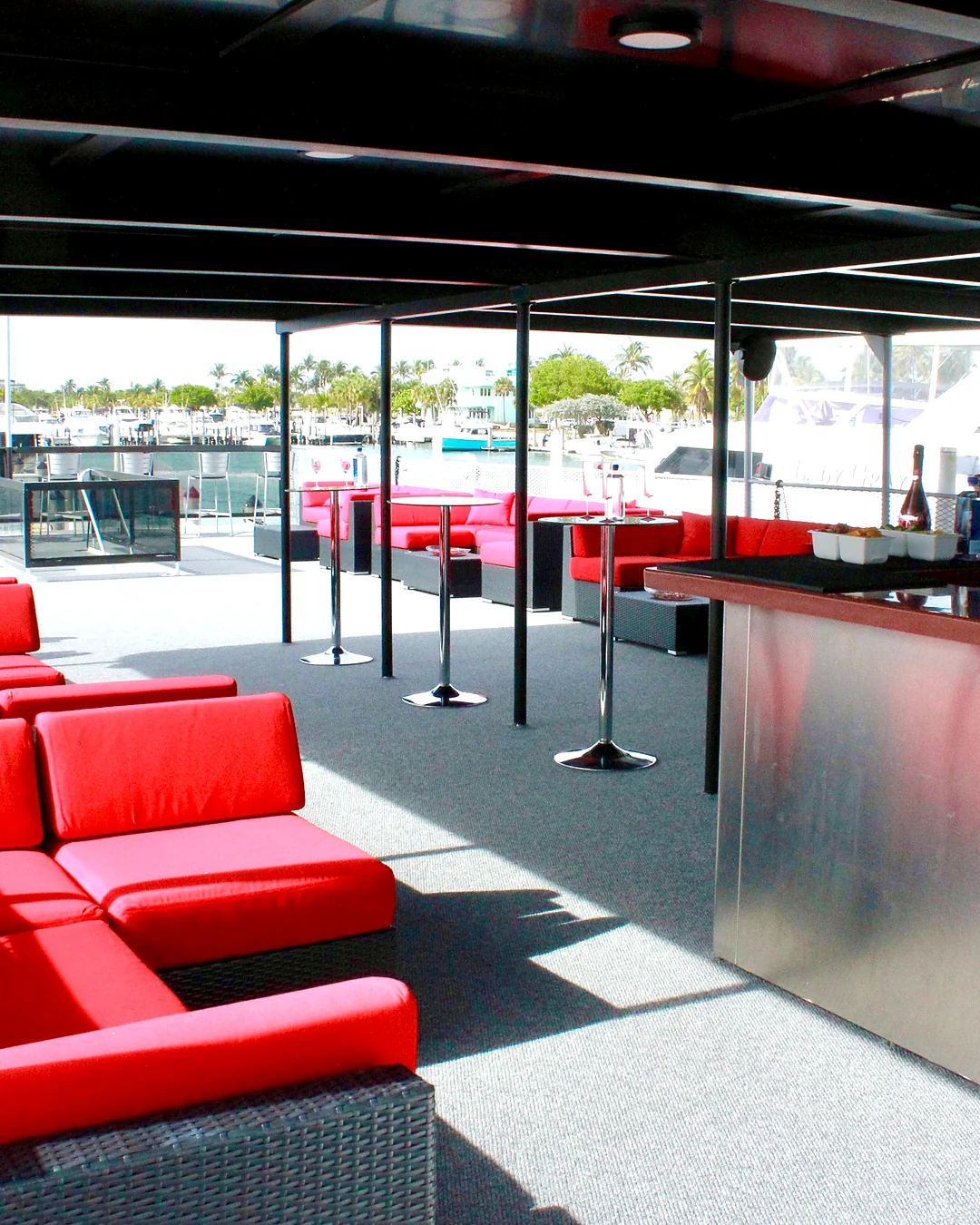 Covered deck bar and lounge aboard Opus Yacht Miami